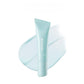 Pale blue lip mask tube carrying a brand mark, shown over a wide swatch of near clear gel