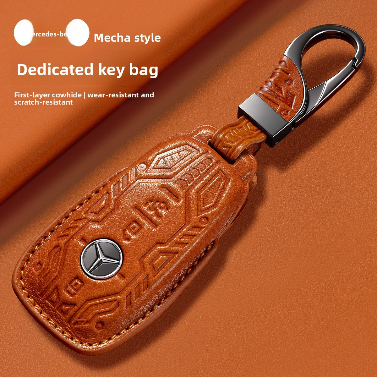 Leather key fob cover in orange cowhide with a metal three pointed star, made to fit Mercedes-Benz smart keys
