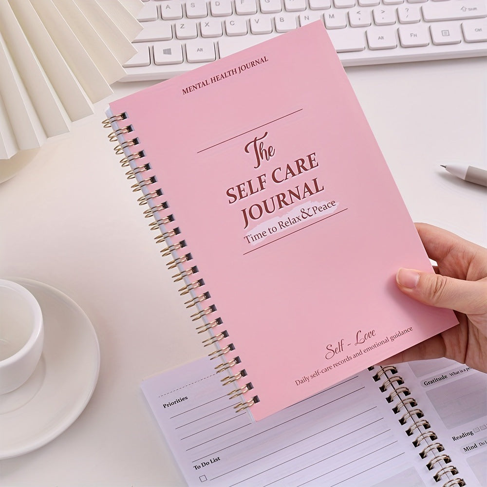 A5 Self-Care Diary Planner shown with a pen ready for a guided reflection entry