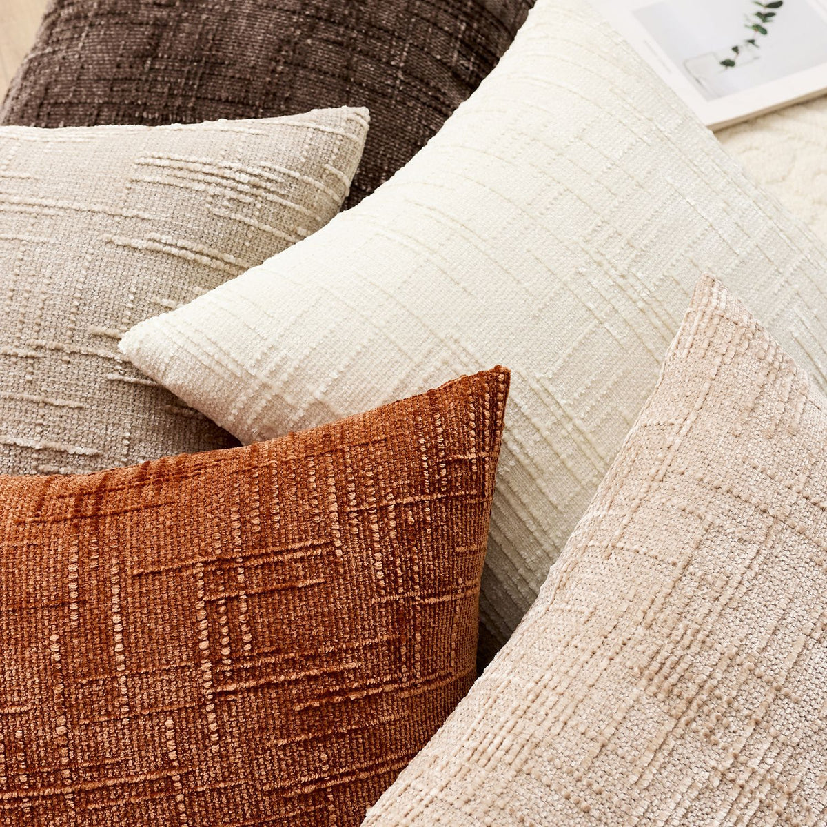 Soft chenille pillow cover in a single solid tone, its tufted crosshatch weave catching the light on the surface