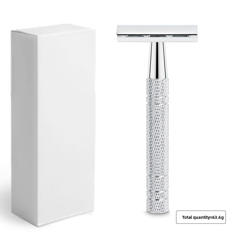 Silver chrome double edge safety razor standing next to a plain white box