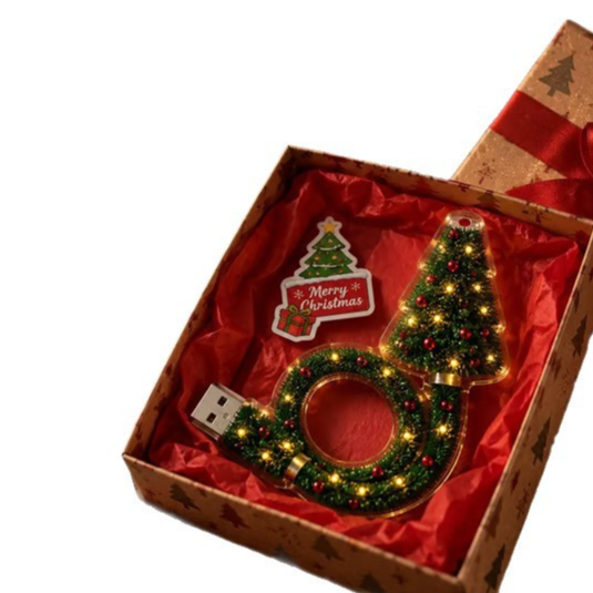 Christmas tree USB projector light with wreath ring and USB plug in a gift box on a white background