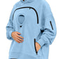 Sky blue oversized fleece hoodie with a round chest pocket, arched zipper and a zip pocket on the sleeve