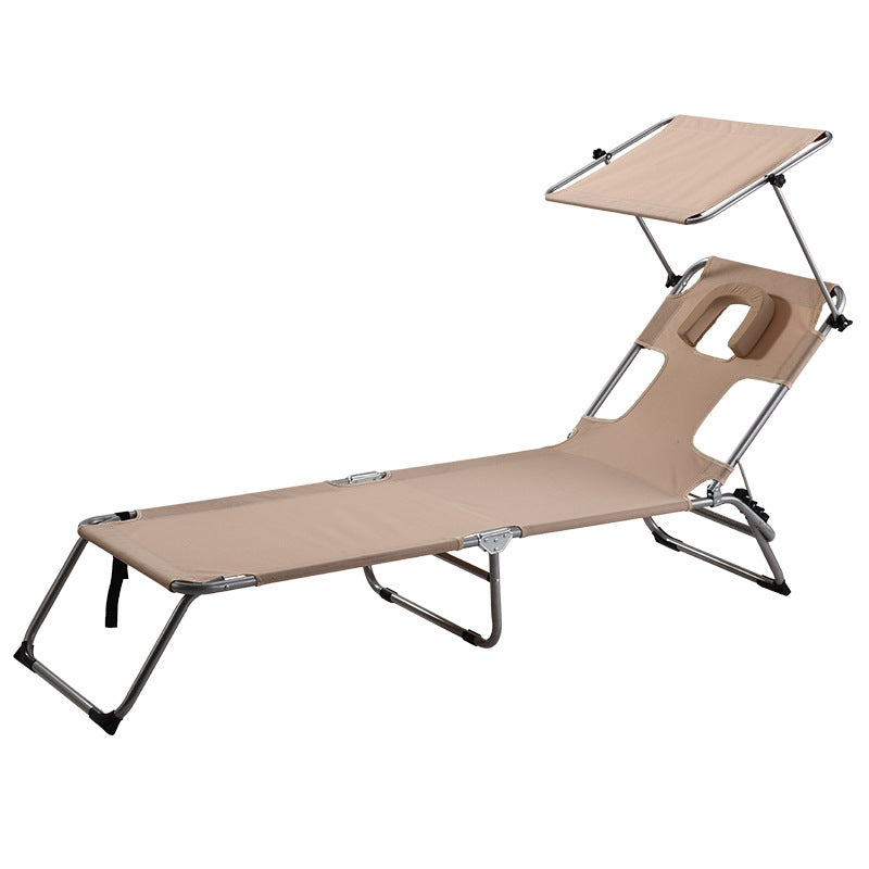 Adjustable foldable sun lounger with canopy on patio front view