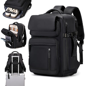 Black travel backpack with shoe compartment, wide interior, and trolley strap over a suitcase handle