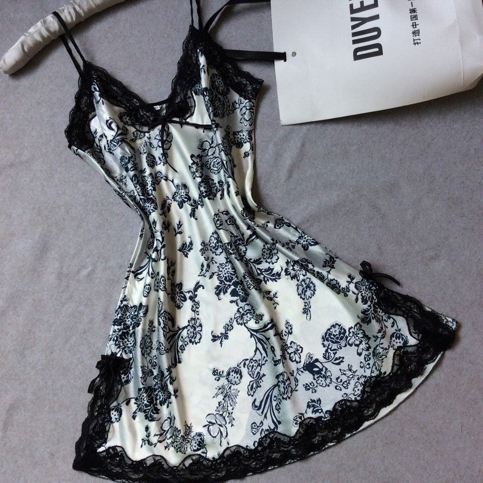 Satin slip nightdress printed with black flowers on a pale ground and edged in black lace, option photo for size L