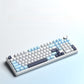 F99 keyboard blue ice colorway with control knob on a light backdrop