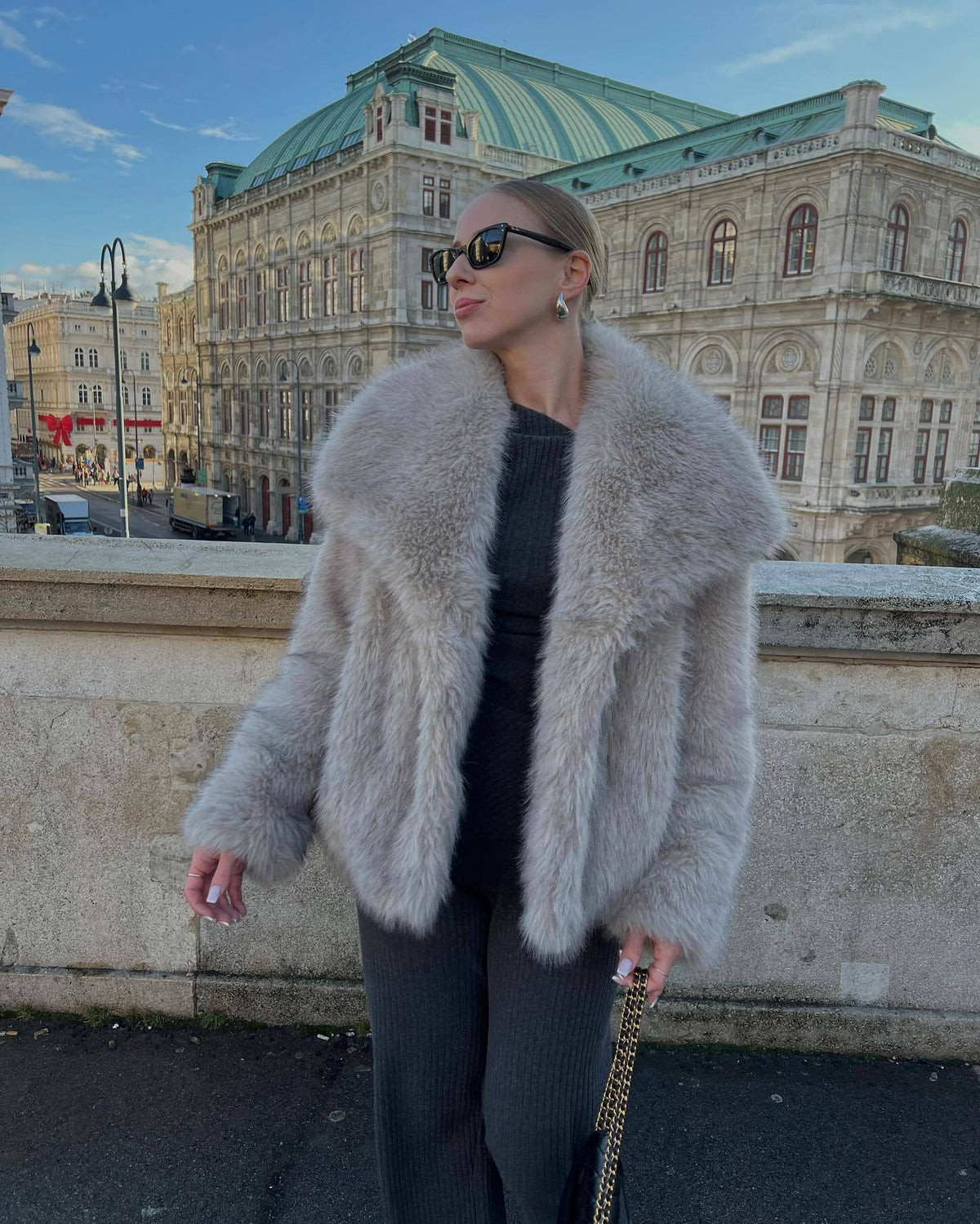 Light gray vegan fur lapel jacket on a model in front of a building, option Light Gray, size M