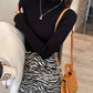 Ribbed mock neck long sleeve knit pullover shown on a model in a soft macaron color