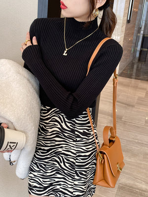 Ribbed mock neck long sleeve knit pullover shown on a model in a soft macaron color