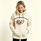 Cream teddy fleece hoodie with a curved zip above the chest opening and a small dog's head looking out