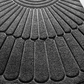 Semi circular polyester entrance door mat with raised fan pattern viewed from above