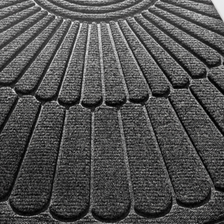 Semi circular polyester entrance door mat with raised fan pattern viewed from above