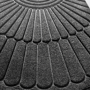 Semi circular polyester entrance door mat with raised fan pattern viewed from above