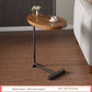 Modern minimalist C shaped side table with an oval top and metal frame for a small apartment