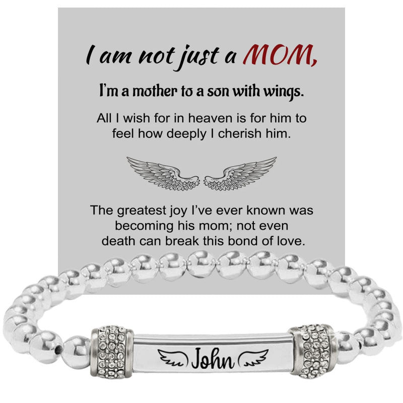 Silver bead bracelet with an engraved bar and silver pave cubic zirconia end rings