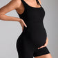 Dark grey maternity romper showing the fitted shorts and ribbed knit