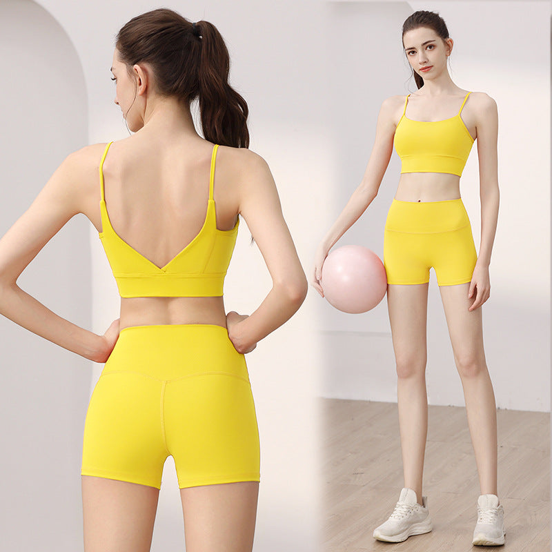 Woman in a yellow V-back sports bra and high-waist shorts set, back view and full-length front view