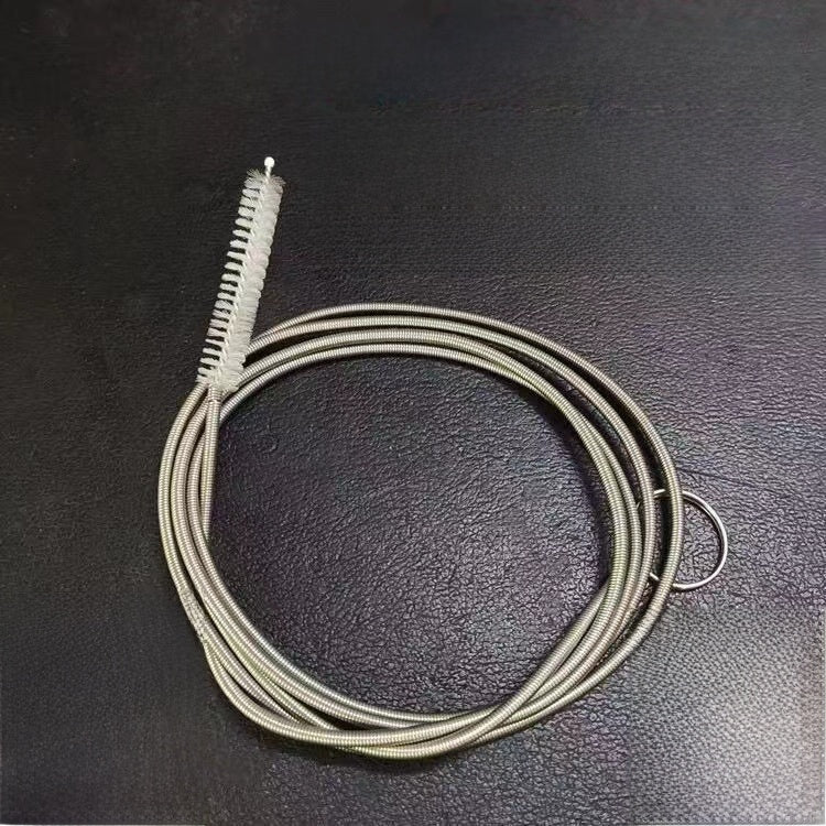 2m SpringBrush option: coiled spring brush with a brush end on a dark surface