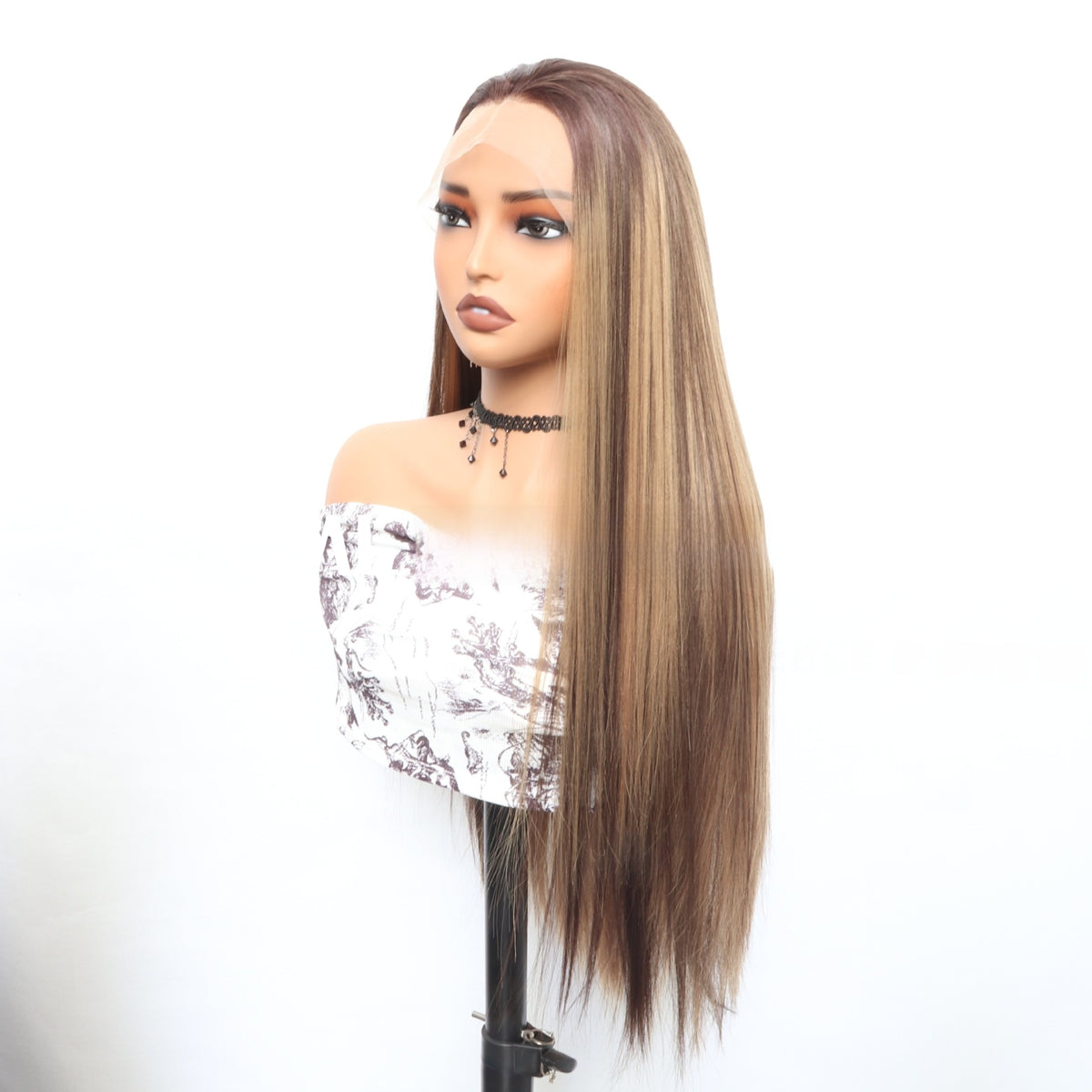 Three quarter view of the long straight Piano color lace front wig with dark roots and blonde highlights