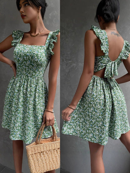Front and back of a green floral square neck ruffle strap mini dress with an open tie back