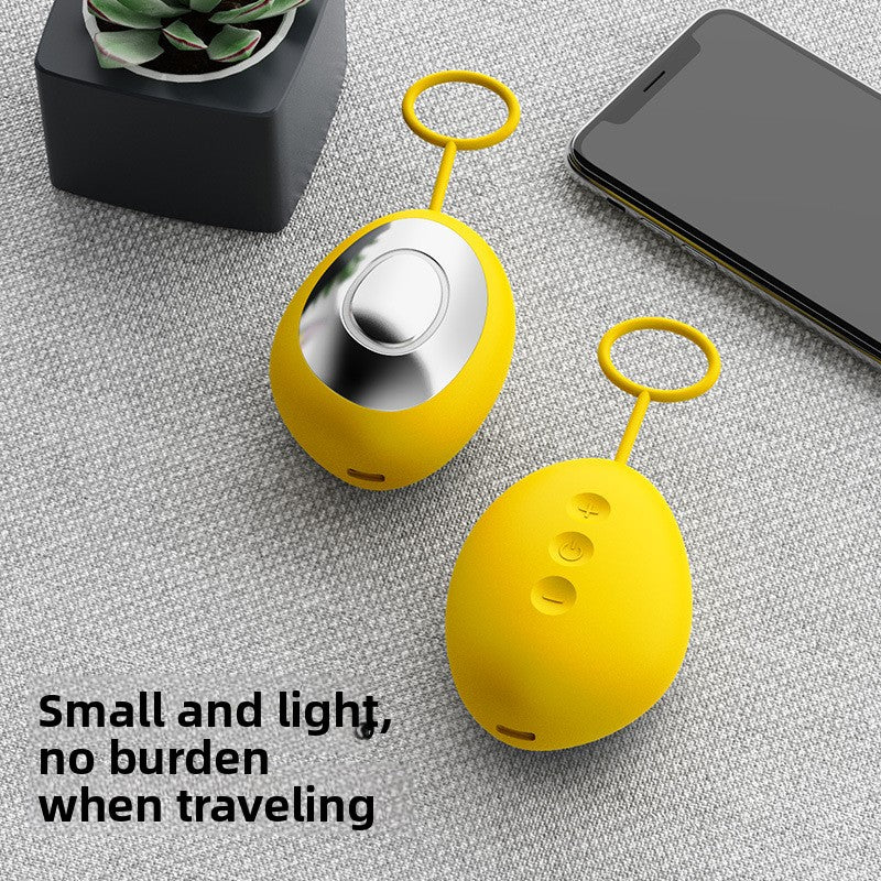 Handheld oval microcurrent sleep aid device with metal contact plate and finger ring