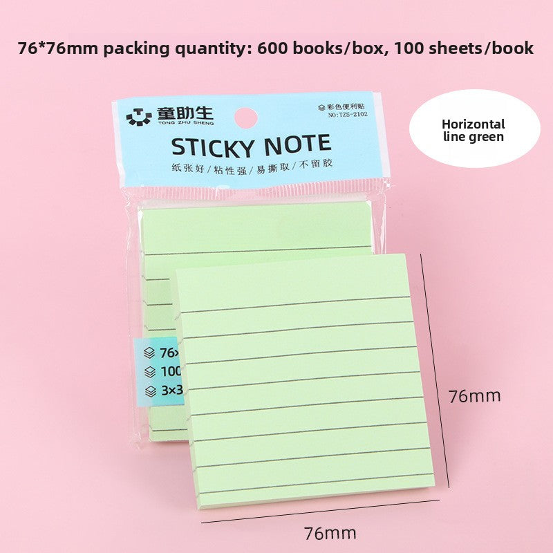 Four colour set of lined sticky note pads stacked together on a study desk