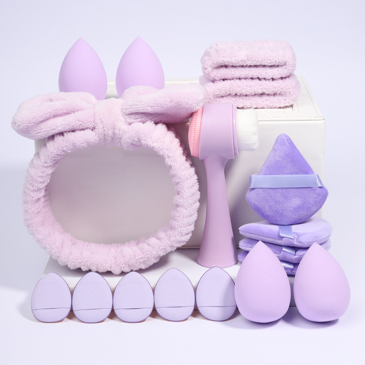 Full boxed set with foam sponges, velvet puffs, a spa headband and a facial cleansing brush