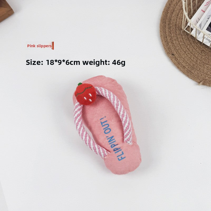 Textured plush pet toy with a built in squeaker, shown on a white studio background
