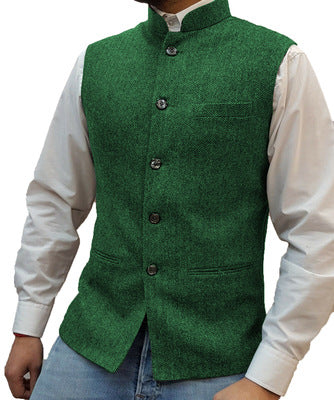 Green herringbone stand collar vest over a white shirt, size XS
