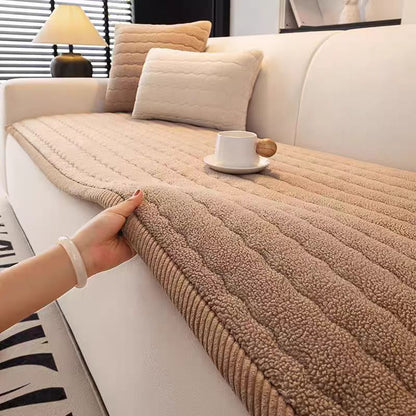 Plush lambswool non slip sofa cushion cover draped over a couch seat