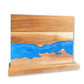 Acacia wood magnetic knife holder with a coloured resin river standing upright on its base