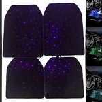 Four black car floor mats with purple star-like points of light and three interior shots of glowing footwells