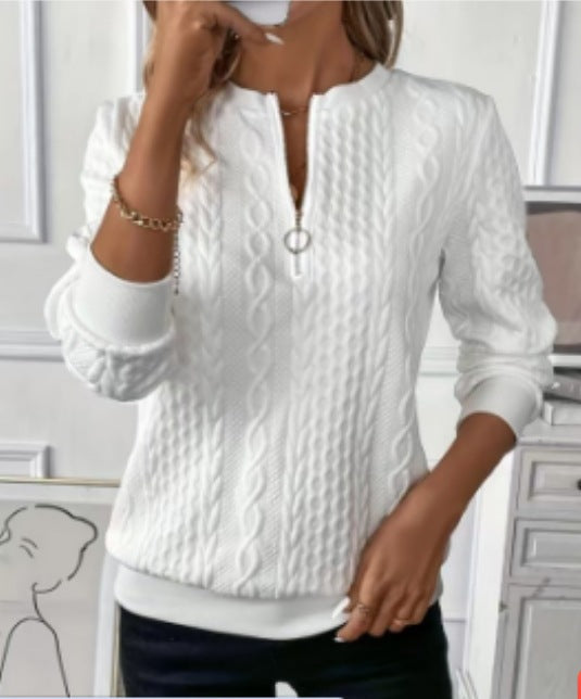 Angled view of a womens quarter zip cable knit pullover in a solid color