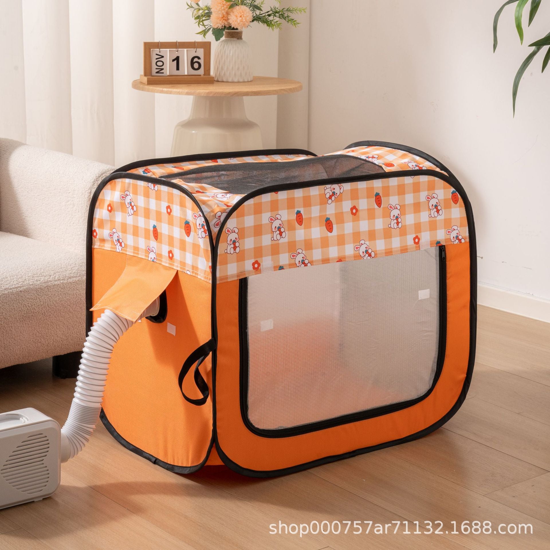 Orange pet drying box with a blower hose and nozzle fitted to the air ports