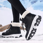 Winter snow boot with folded white plush collar, speckled laces and a thick lug sole