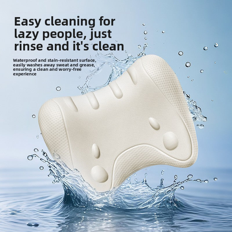 Ivory foam neck pillow with raised nodes splashing in water to show the rinse clean surface