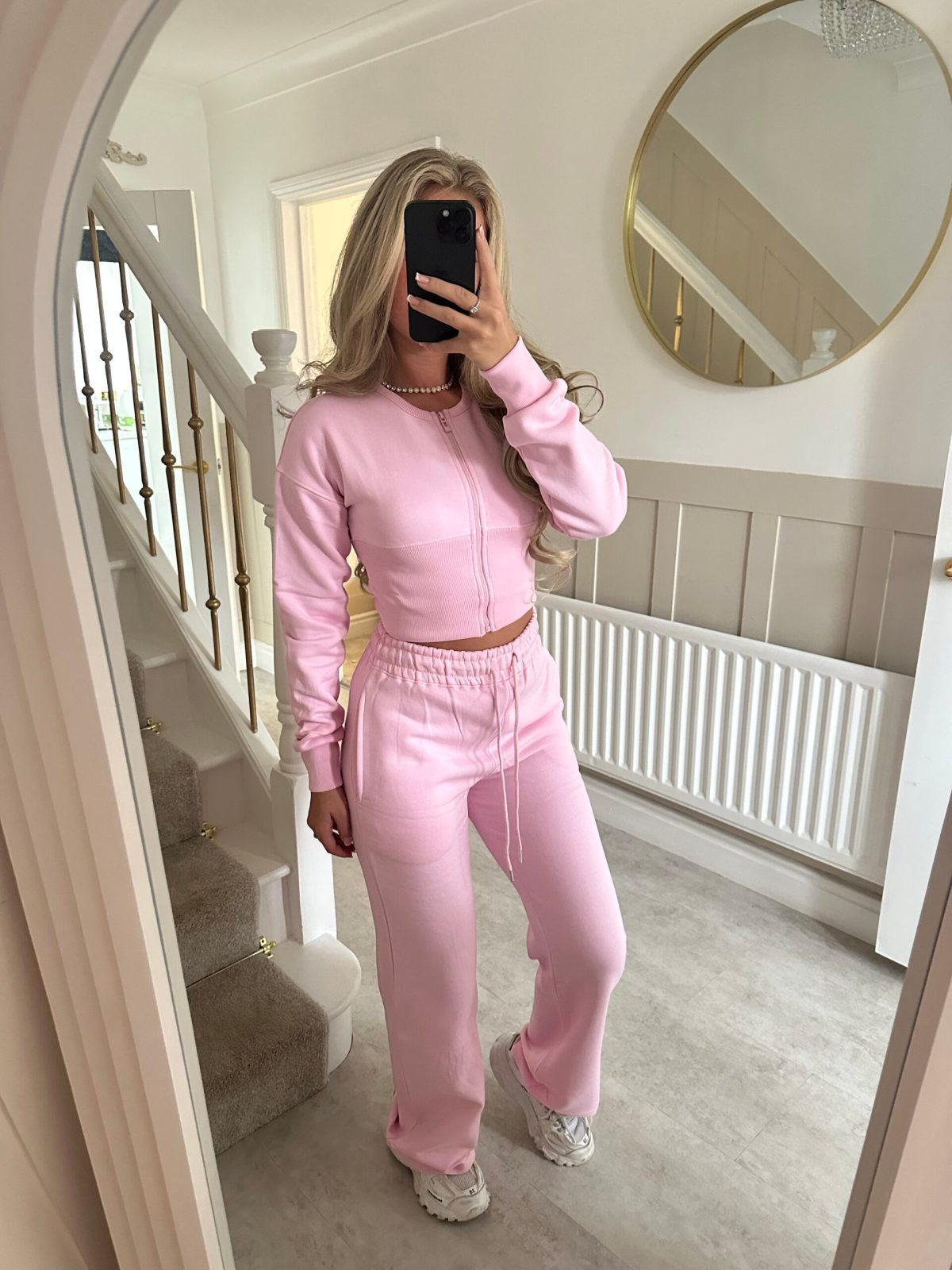 Womens two piece lounge set, a front zip jacket and straight leg drawstring pants in a soft sweat knit
