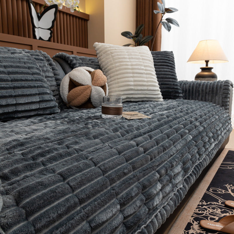Winter Rhythm Dark Gray ribbed plush sofa cover on a sofa, 90 x 240 cm