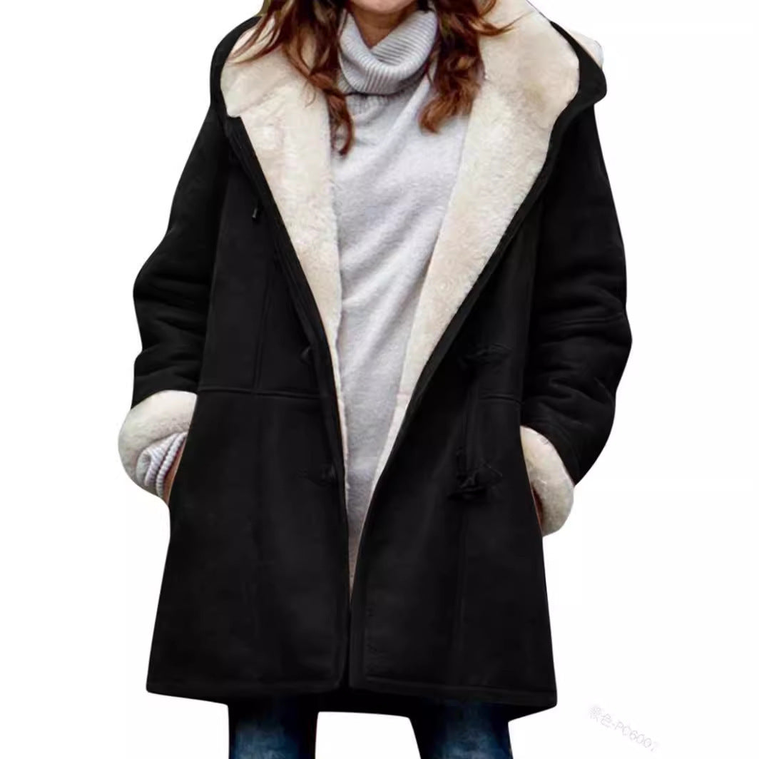 Model in an open black hooded toggle coat showing the white plush lining, cuffs and side pockets