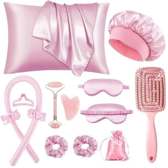 Pink heatless curling rod set with pillowcase, bonnet, eye masks, scrunchies, face roller, gua sha and hair brush