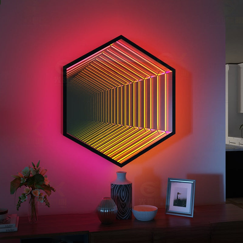 RGB infinity mirror lamp glowing green and pink mounted on a dark feature wall