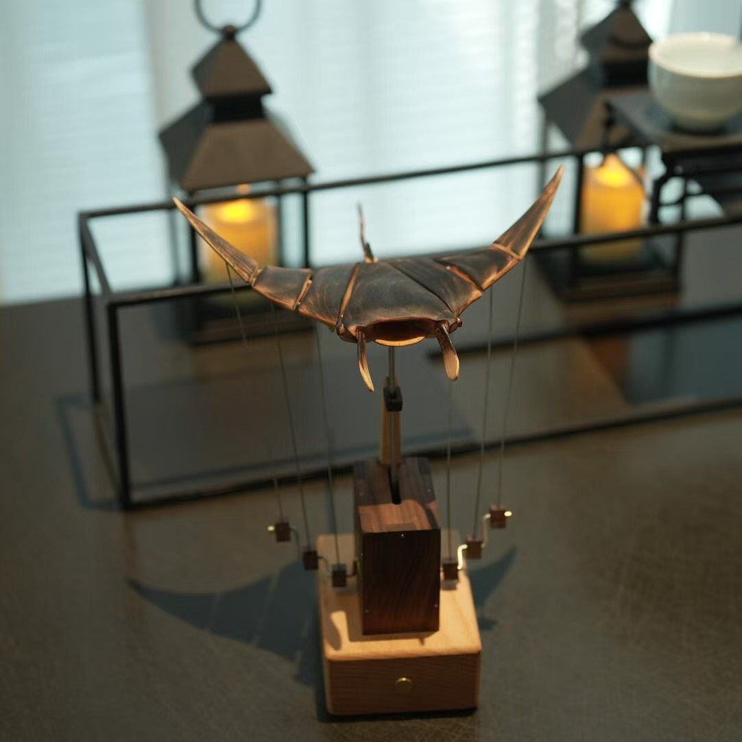 Front view of the solid wood desk figurine showing its carved shape
