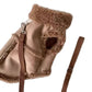 Back view of a brown dog vest with fleece trim and a leg opening and leash loop