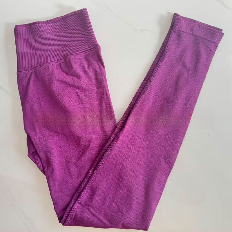 Plum purple seamless leggings with the curved knitted seat panel visible on the flat lay