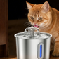Ginger cat drinking from the flower dome spout of a stainless steel pet water fountain in a kitchen