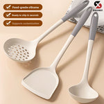 Three gray and white silicone kitchen tools, a skimmer, a turner and a ladle, on a counter