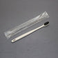 Disposable toothbrush and toothpaste travel set shown with its sealed film pouch on a plain ground