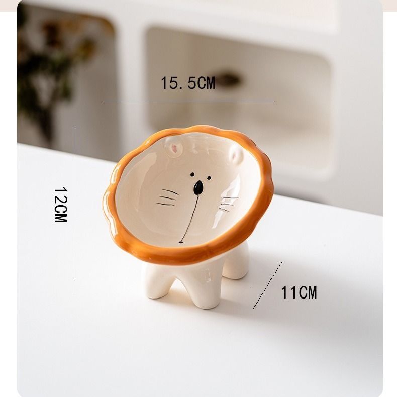 Lion bowl on four legs with 15.5 CM, 12 CM and 11 CM dimension marks beside a white cabinet