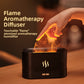 Black flame effect diffuser and humidifier glowing on a wood table with a hand near the mist